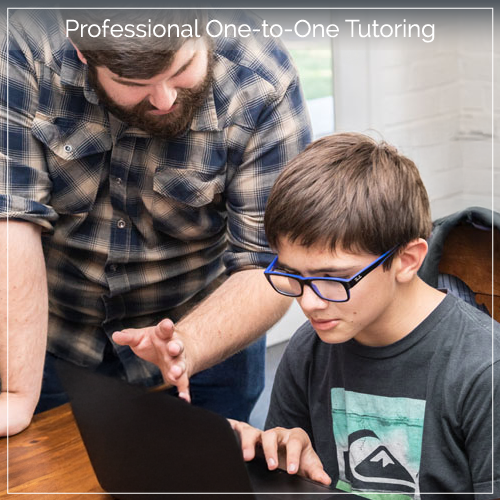 Male teacher tutoring pre-teen boy