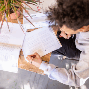 view from top of teenage boy studying for college admissions test
